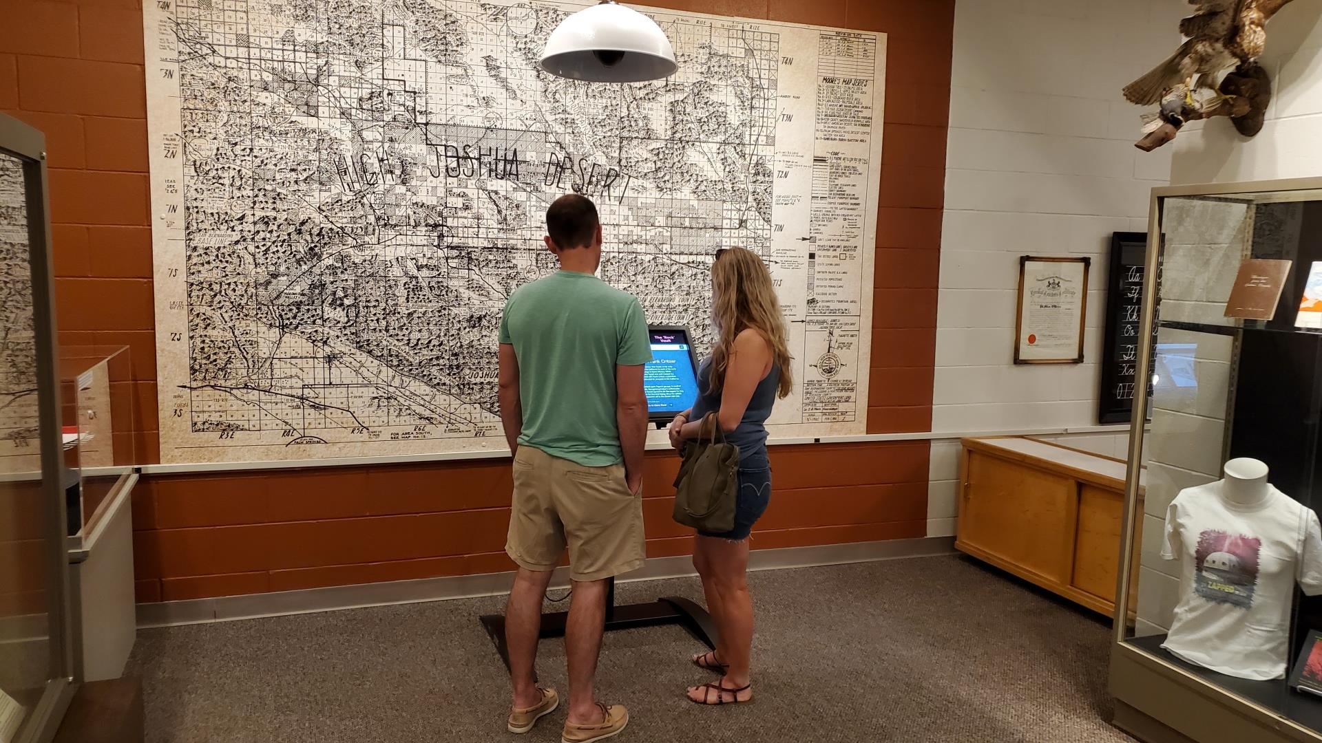 People looking at the Our Giant Rock exhibit